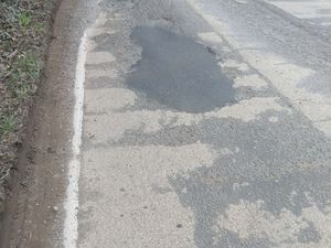 Supporting image for story: 'Dreadful section of road' - Motorist takes things into his own hands to warn about potholes at busy Shropshire junction