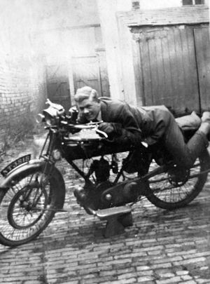 With one of his motorbikes which he used to ride in the Shropshire countryside in the 1920s