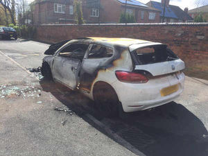 The burnt out car