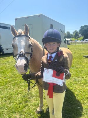 Millie Wozencroft, 10 years old qualifies for London International Horse Show on first attempt on her pony Nantfforchog Blue Romishe.