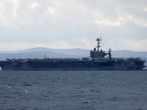 Supporting image for story: Fighter jet landing on US aircraft carrier goes overboard