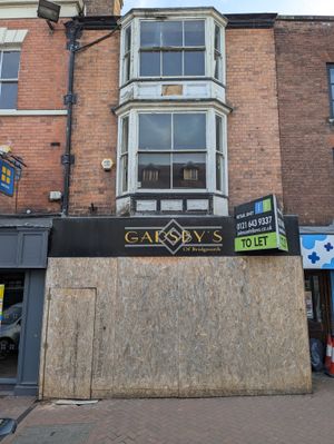 The boarded up shop
