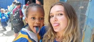 Grace James with a child at the Rezina Centre, Mathare.
