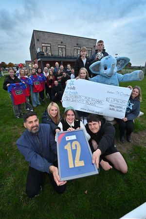 Showing off 'fearless' Ellie's retired number 12 shirt are her father - Antony Thomas, step-mother - Louise Thomas, mother - Rachel Thomas, and brother - Ethan Thomas. They were joined by Ellie's family, friends, former Wrekin Lionesses teammates, and representatives of the 2Wish charity, as they presented more than £2,500 to the organisation in Ellie's name.