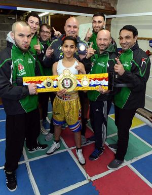 Just champion - The coaches celebrate Wellington's first national champion in Husan Hussain at their Mill Lane gym.