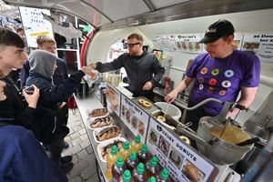 Kyle helps the team at Old Tom's to sell doughnuts