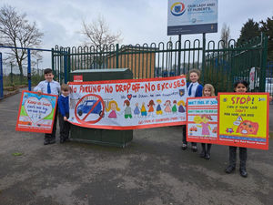 Pupils Blake, Oliver, Hannah, Esme and Khushi pictured with the signs