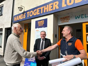 Richard Collishaw (Ludlow Freemasons) shaking hands with Andy Fensome (Hands Together Ludlow)