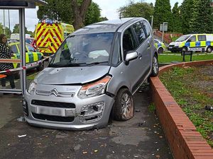 Supporting image for story: Car left hanging from wall after Brierley Hill smash