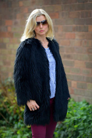 Lisa Williams models top label clothes donated by WBA keeper Ben Foster at Women's Aid charity shop, Solihull