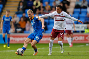 Taylor Perry of Shrewsbury Town and Shaun McWilliams of Northampton Town (AMA)