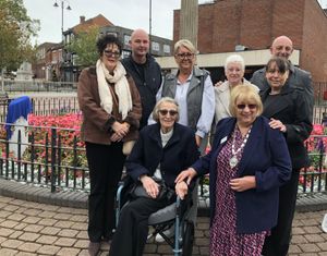 Ethel Powell's daughter, grandchildren and other family members with SI Cannock & District Team President Carole Holdcroft