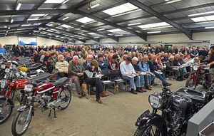 Buyers attend the bike auction at the showground