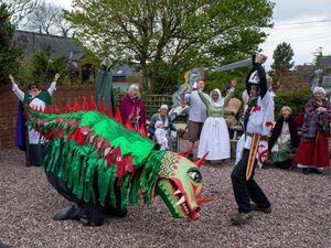 Supporting image for story: George and the dragon do battle to entertain crowds on Shropshire ale trail