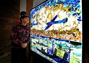 Director of Stourbridge Glass Museum Alexander Goodger views the section of the Churchill Memorial Screen on display at the museum.
