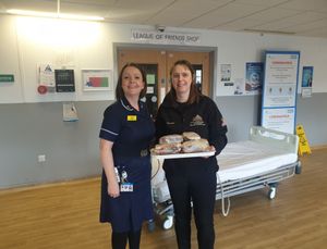 Staff at Walsall Manor enjoy some of the sandwiches sent by Marston's