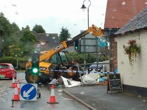 The aftermath of the raid, with the JCB still on site