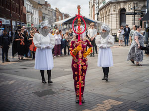 The performers of Mothers Without Hands in Walsall Town Centre.