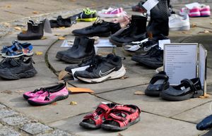 Shoes with notes on placed near to The Guildhall in Shrewsbury.