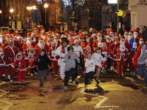 Supporting image for story: Santas take to streets in Shropshire Christmas celebrations