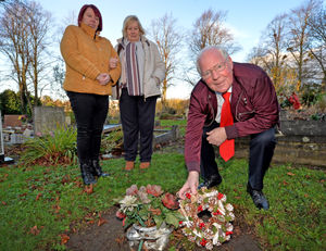 Tony Whittaker is pictured with his wife Marlyn and daughter, Shirley Shipley, at Harold Thompson's grave
