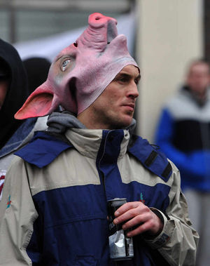 Wearing a provocative pig mask