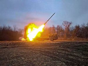 A Russian self-propelled multiple rocket launcher being fired