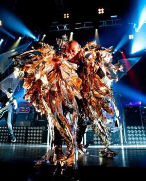 Wearing an eye-catching gold feathered coat, eccentric frontwoman Skin unleashed her distinctive vocals to perform a host of the band's greatest hits.nextpage