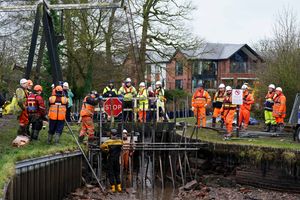 Waterways engineers working alongside the Canal and River Trust make a temporary dam. Photo: Jacob King/PA Wire 