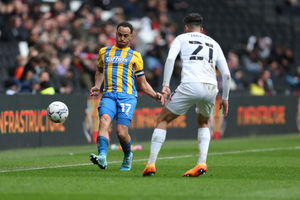 Elliott Bennett of Shrewsbury Town and Daniel Harvie of Milton Keynes Dons (AMA)