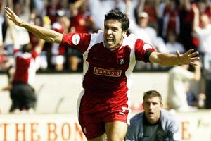 Walsall's Jorge Leitao celebrates scoring their third goal, as West Bromwich Albion goalkeeper Russell Hoult (bottom right) looks on.