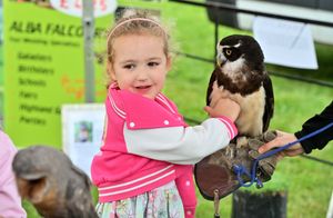 Evie Osenton, 5, holds an owl