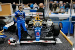 British Former F1 Racing Driver Nigel Mansell with the Williams FW14B 1/12 Model