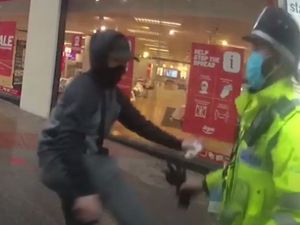 Supporting image for story: See the moment fugitive armed robber attacks officers after coming out of hiding to buy Call of Duty