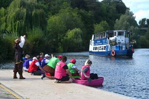 Racers watch on as the Sabrina boat makes its way past