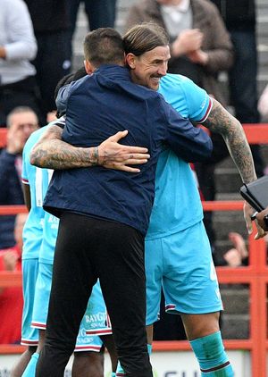 Walsall manager Mat Sadler and Aden Flint at the final whistle.