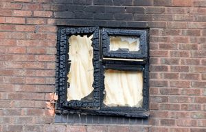 A window had to be boarded up after it smashed during the blaze