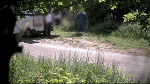 Video grab of a couple flytipping on a rural road near Royal Wootton Bassett, Wiltshire. Video shows the moment a couple was caught flytipping piles of cardboard and rotten food waste on a country road - before being fined £3,000. CCTV cameras set up on a rural road near Royal Wootton Bassett, Wiltshire, captured the couple fly-tipping on two separate occasions.The couple arrived on a white van and dumped piles of cardboard, plastic and rotten food - all of which came from a commercial business. Officers were able to trace the couple after their vehicle and registration was also captured in the footage.