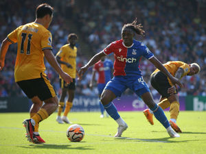 Eberechi Eze of Crystal Palace looks to take on Hwang Hee-chan of Wolverhampton Wanderers (Photo by Steve Bardens/Getty Images)