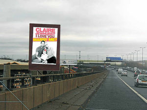 Supporting image for story: Romantic partner pops question using giant advert on M5