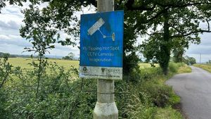 Signs warning of CCTV along the route.