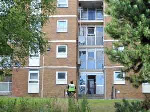 Police at the scene in Brierley Hill where a knifeman was stood on the wrong side of balcony railings