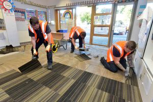 Workers making repairs at Tipton Green Junior School last October