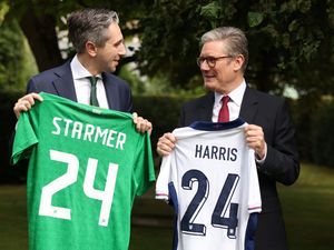 Ireland's PM Simon Harris and Sir Keir Starmer swap football shirts during a visit to Dublin