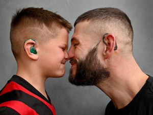 Supporting image for story: Caring Walsall dad gets hearing aid tattoo to match son's device