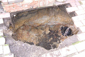 The hole which opened up in Broseley. Photo: Shropshire Fire & Rescue Service.