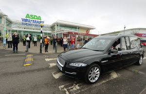 The funeral cortege of Doris Hobday passes ASDA Great Bridge, on the way to the church, as staff and shoppers pay their respects
