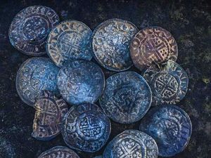 Supporting image for story: 800-year-old coins dug up by detectorists near Oswestry