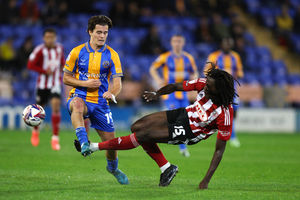 Leo Castledine of Shrewsbury Town and Johnny Yfeko of Lincoln City (AMA)