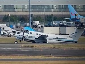 Supporting image for story: Birmingham airport aircraft incident: Moment plane drags along the runway after making emergency landing